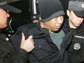 聯合分屍10人 逃亡十年終被捕