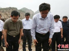 北京市官員向“7‧21”水災遇難者致哀